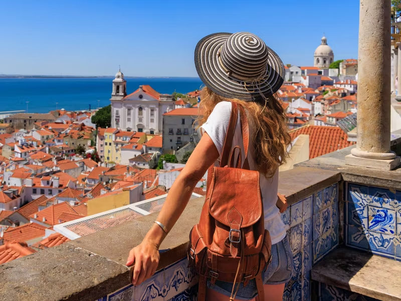 A woman overlooking beautiful European architecture.