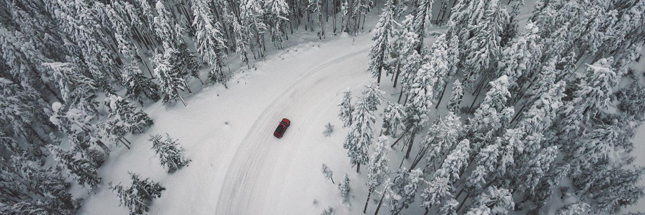 How to Drive in Winter - car on a snow-covered forest road