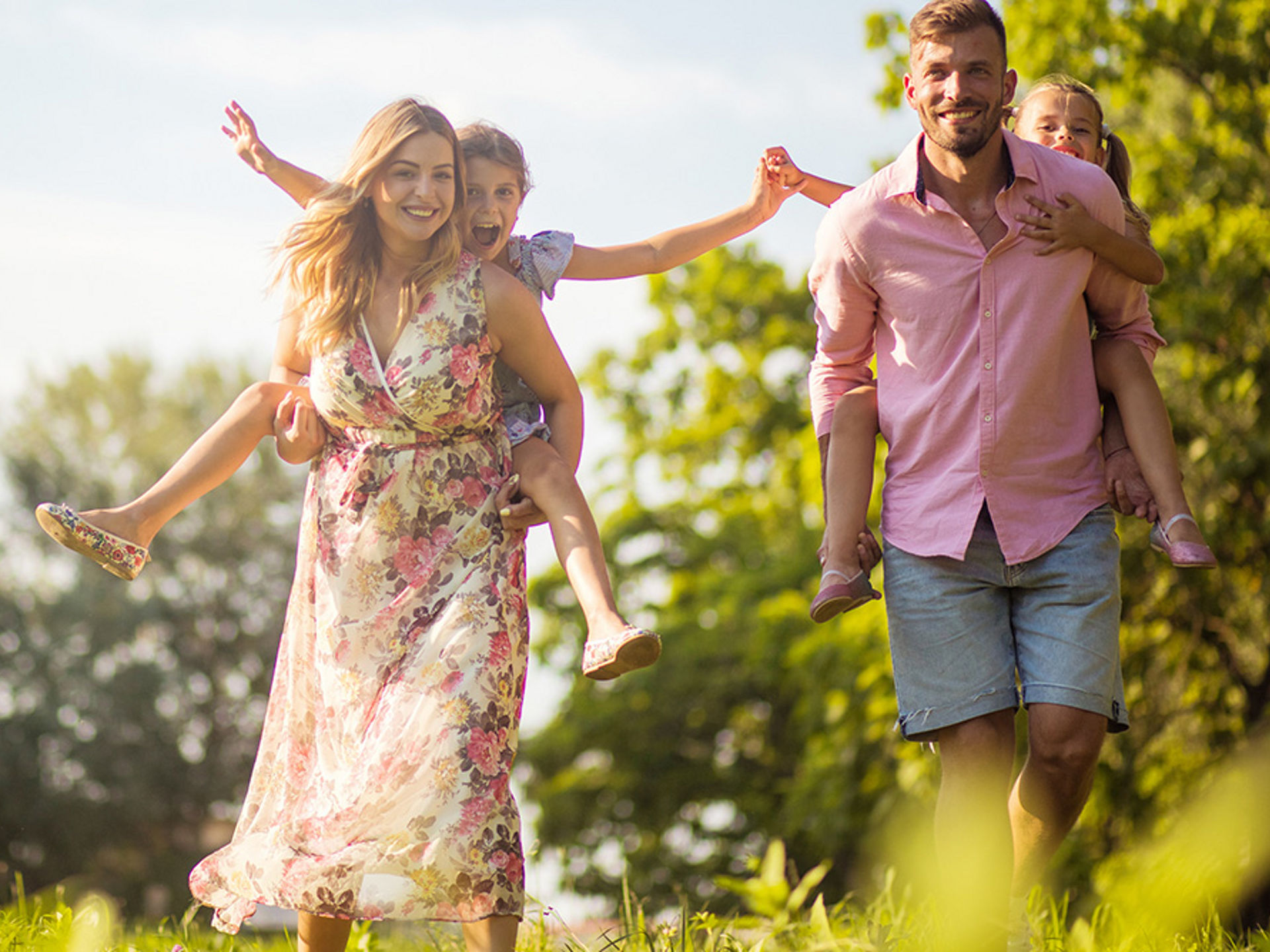 Parents with their daughters in nature.